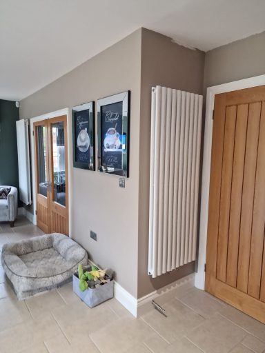 Designer radiator installed in a kitchen, delivering efficient heating with a stylish finish and professional, high-quality installation.
